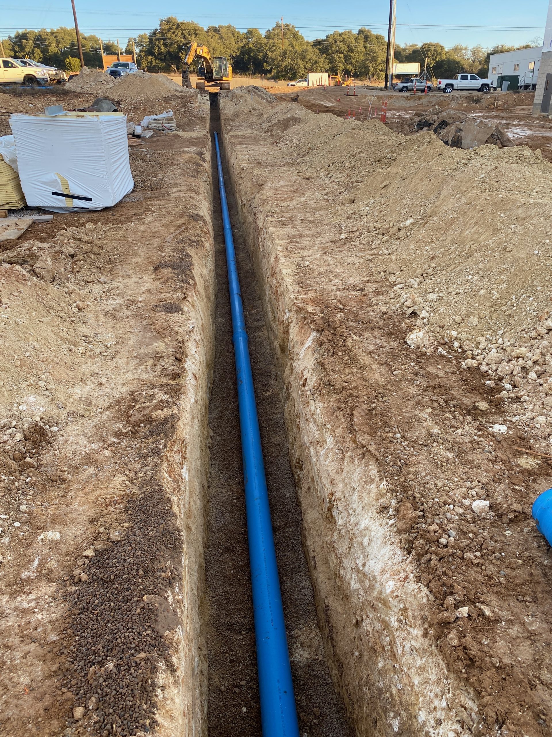 Very long blue pipe going off into distance.